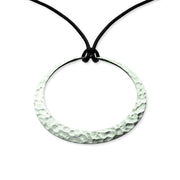 Eclipse pendant Sterling silver (  .925 EcoSilver), finished with a polish & hammered style. Dimensions:   46mm (approx. 1 7/8" x 1 1/2"). Length: 30" adjustable silk cord.
