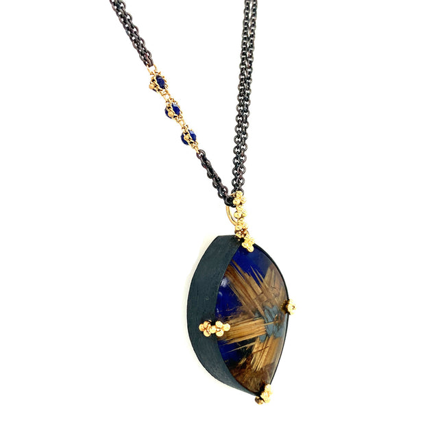 lapis lazuli and rutilated quartz doublet  pendant on an oxidized sterling silver chain with small lapis accents and yellow gold