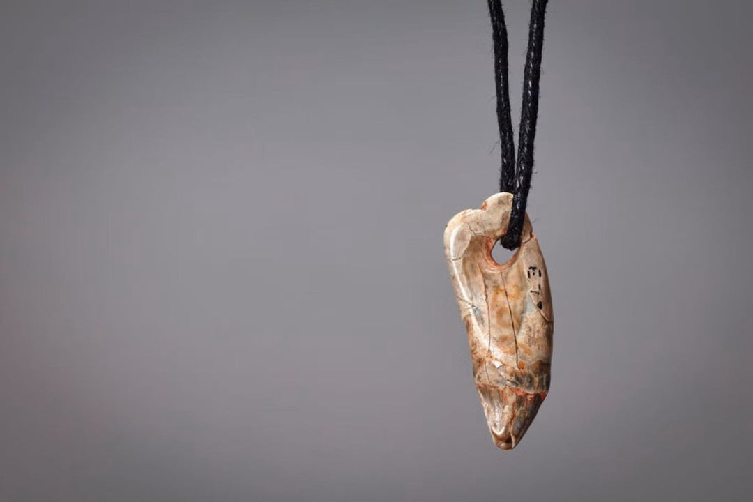 A 15,000-year-old seal-tooth pendant found in a Devon cave reveals how Magdalenian Ice Age people used jewelry to signal identity, status, and culture.