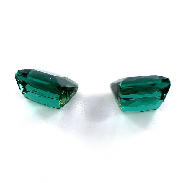Two green tourmalines with pavillion view