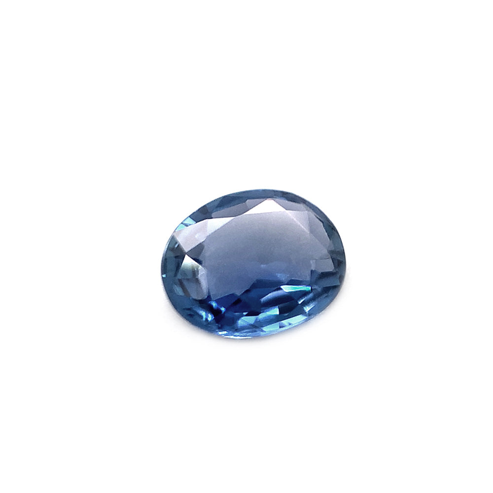 Oval blue Yogo sapphire on white background