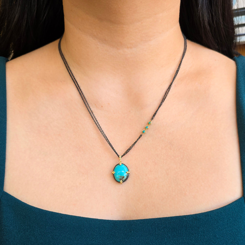 Woman wearing Blue Mesa Blue Moon turquoise necklace by Amáli from Alara Jewelry