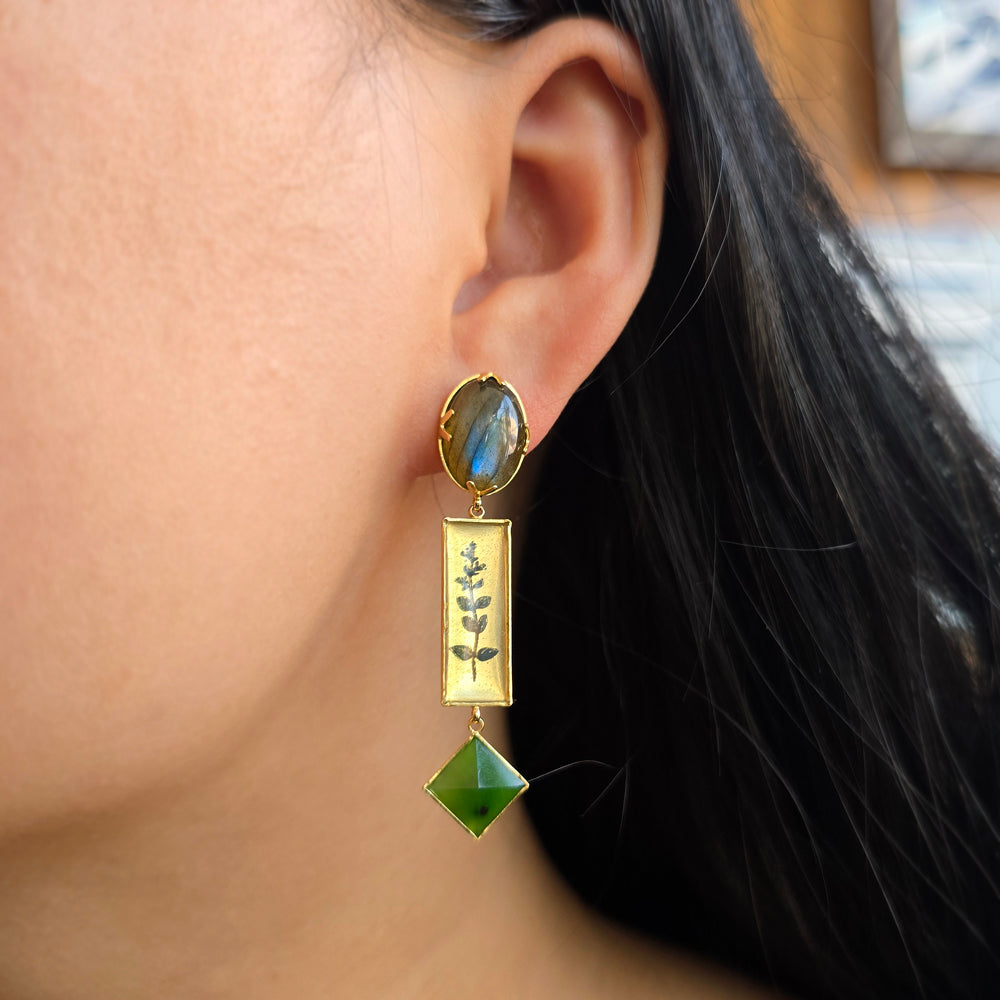 Woman wearing Night Garden botanical earrings by Anna Bánkuti from Alara Jewelry
