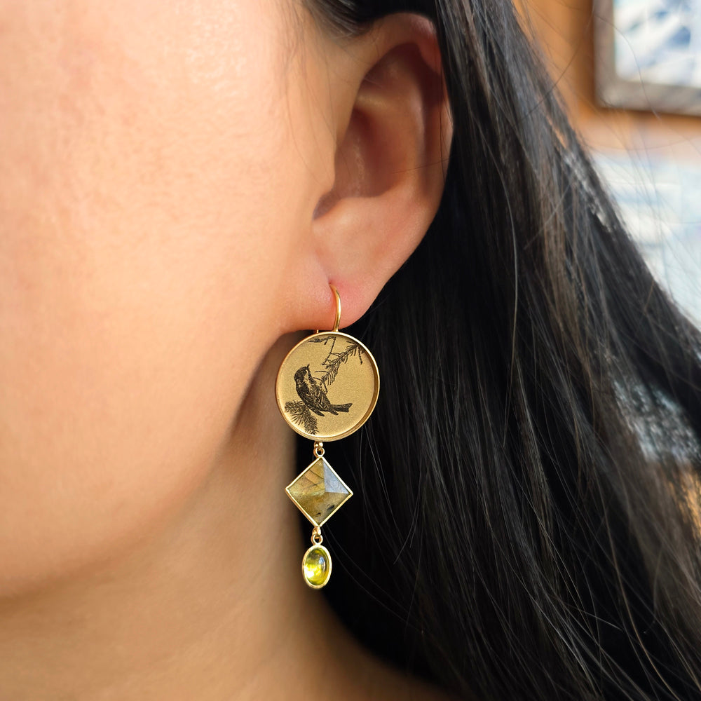 Woman wearing Passing Through sparrow earhangers by Anna Bánkuti from Alara Jewelry