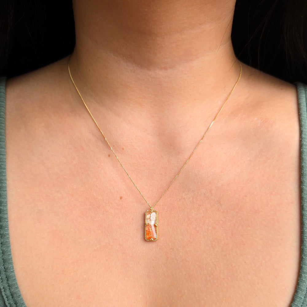 Woman wearing Heat Haze sunstone necklace by Amáli from Alara Jewelry