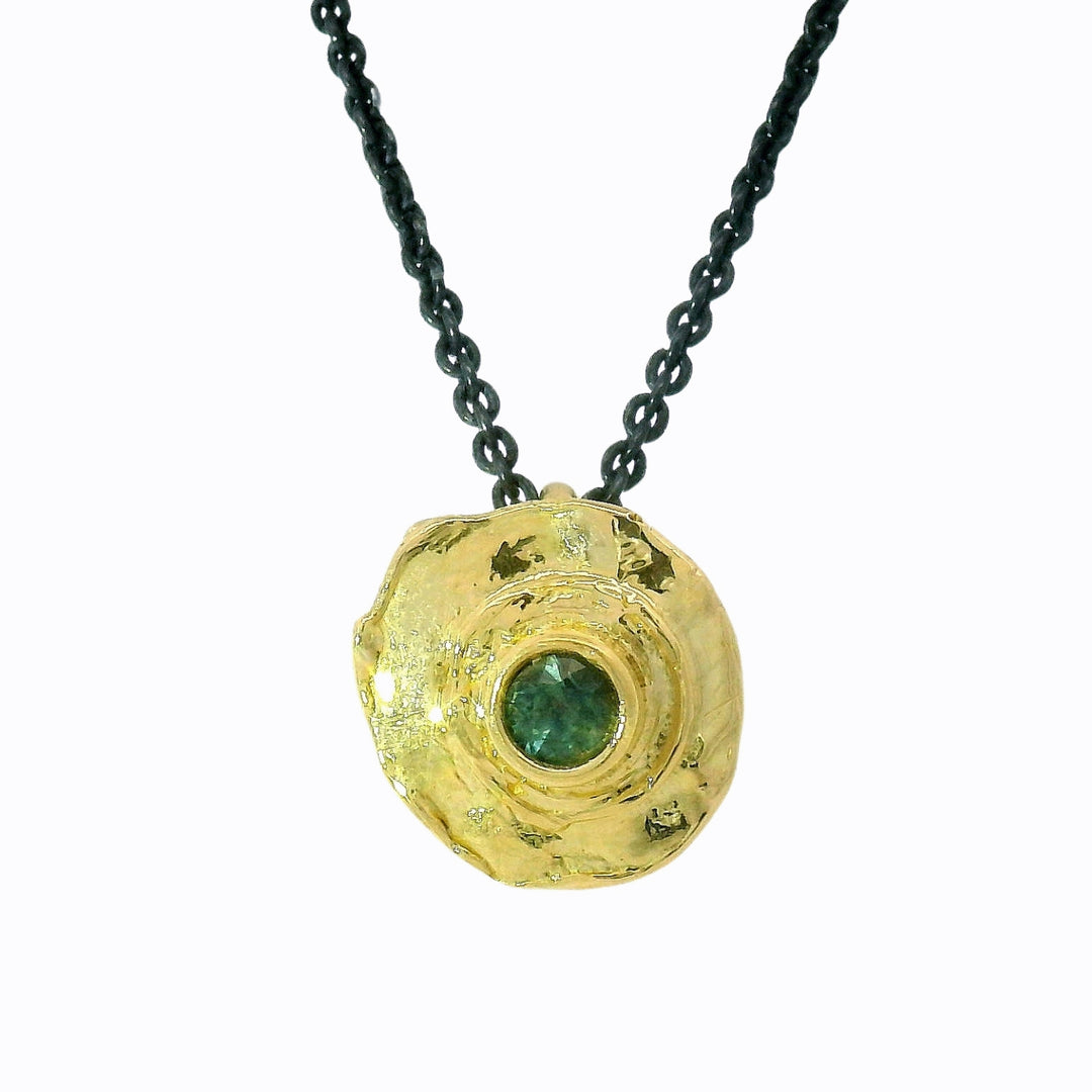 Textured 18K yellow gold bullet-inspired pendant with round sapphire center