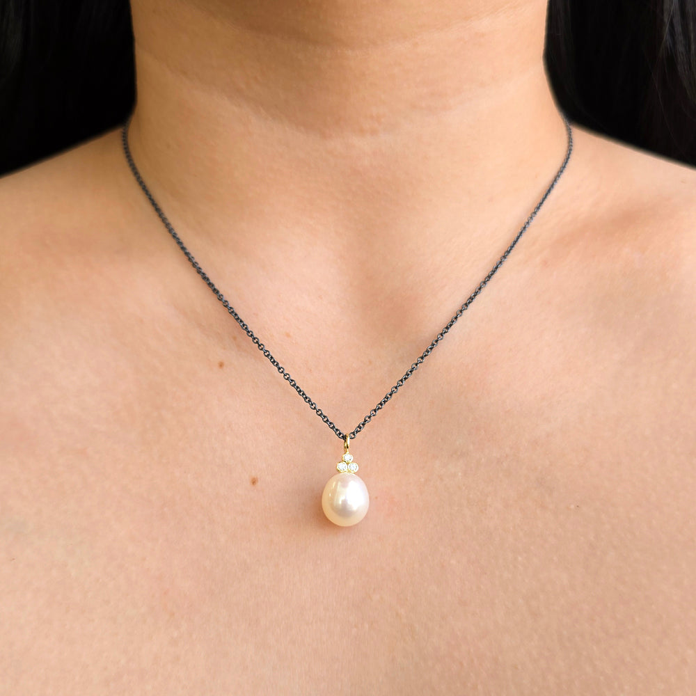 Moonlight pendant featuring luminous pearl with diamond accents