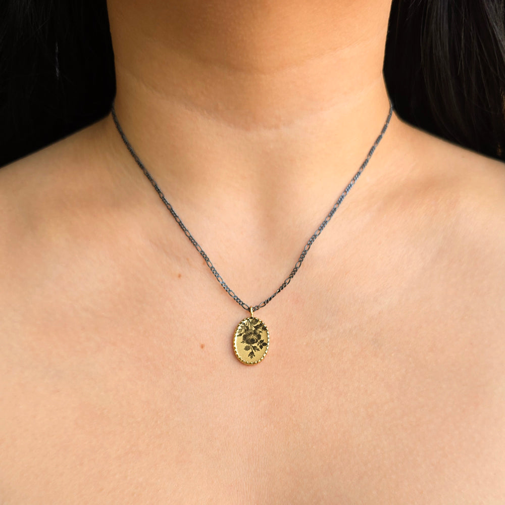 Woman wearing Pressed Rose botanical necklace by Anna Bánkuti from Alara Jewelry