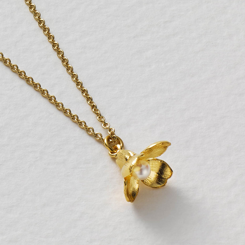 Sculpted floral pendant with white freshwater pearl accent