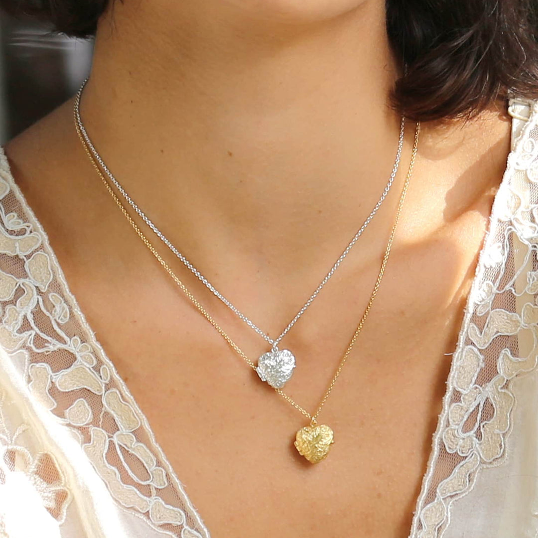 Woman wearing Victoriana heart locket necklace by Alex Monroe from Alara Jewelry