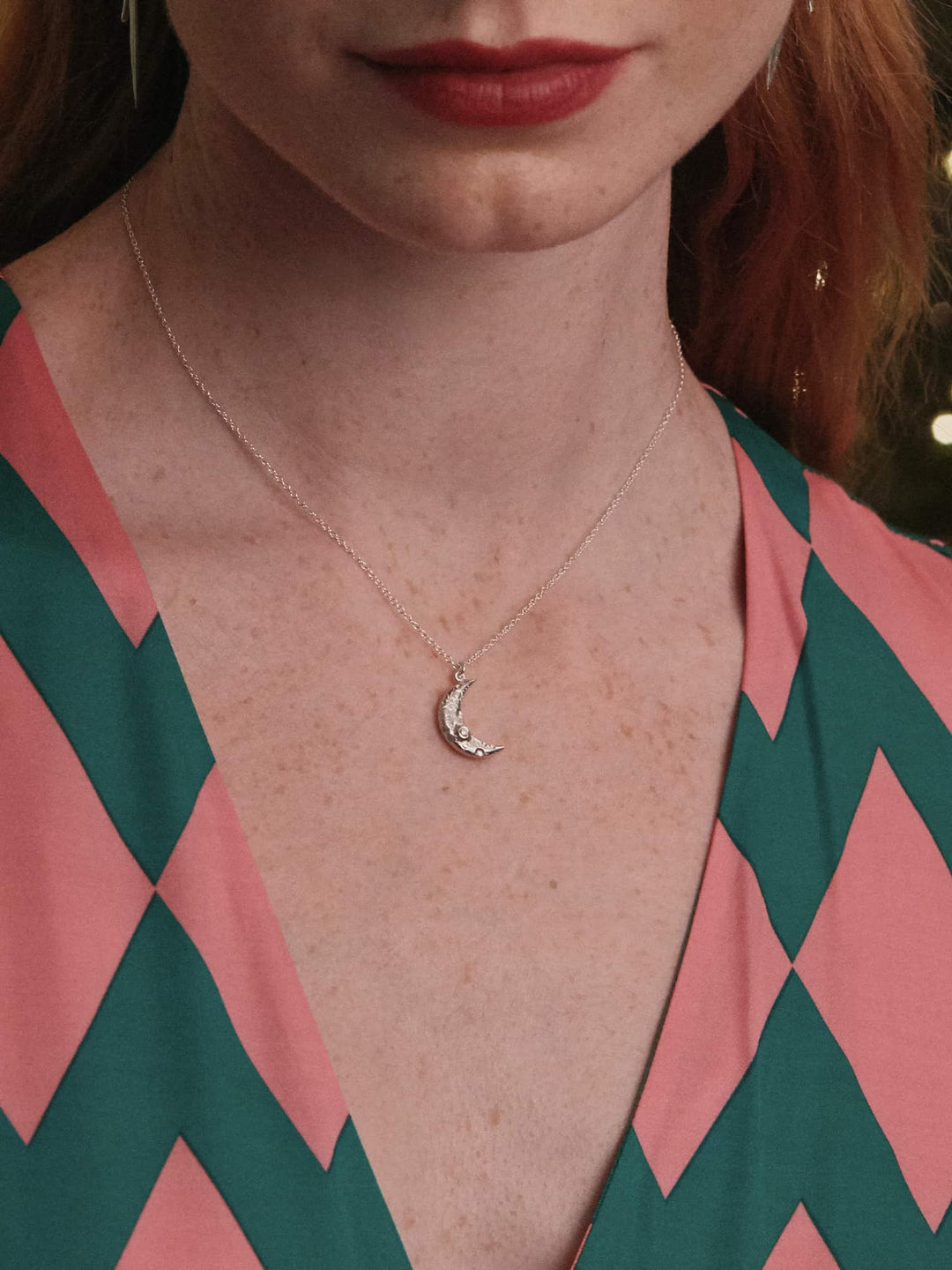 Woman wearing crescent moon diamond necklace by Alex Monroe from Alara Jewelry