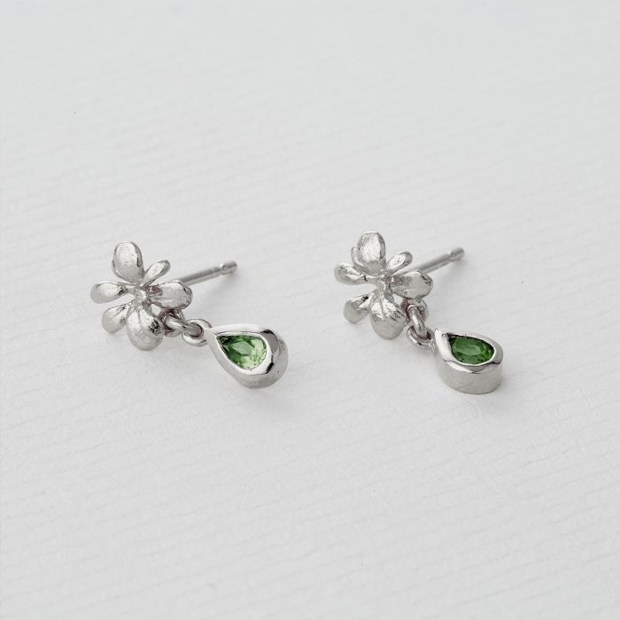 Close-up of sculpted leaf rosette and peridot gemstone detail
