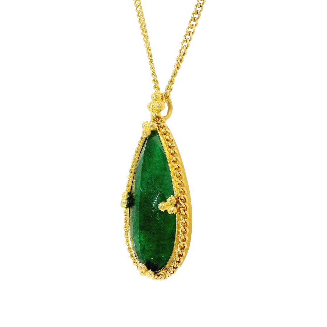Close-up of pear-cut emerald showing natural internal character