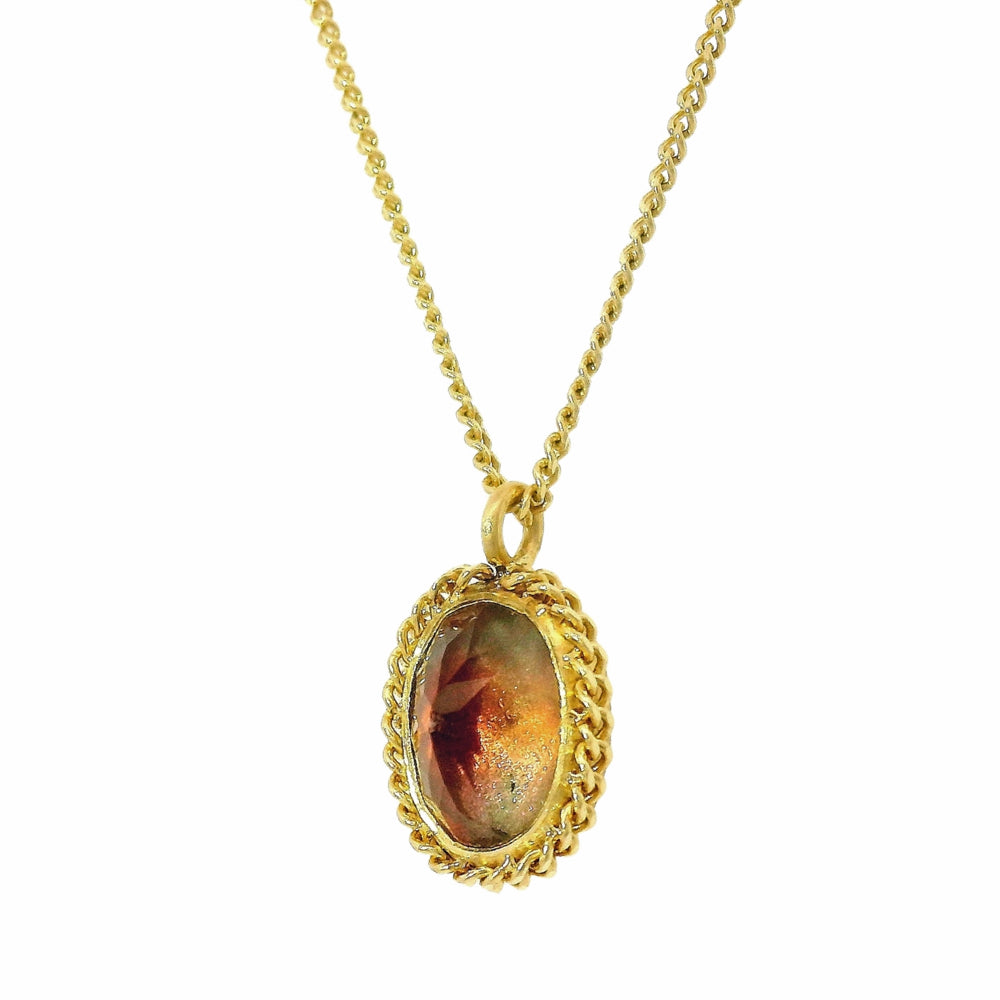 One-of-a-kind sunstone pendant with woven gold frame detail