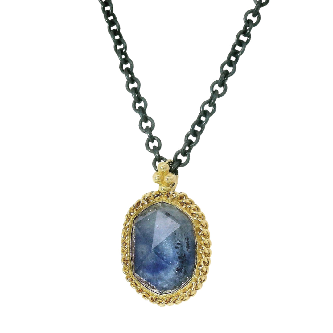 Close-up of rose-cut Montana sapphire showing denim blue color