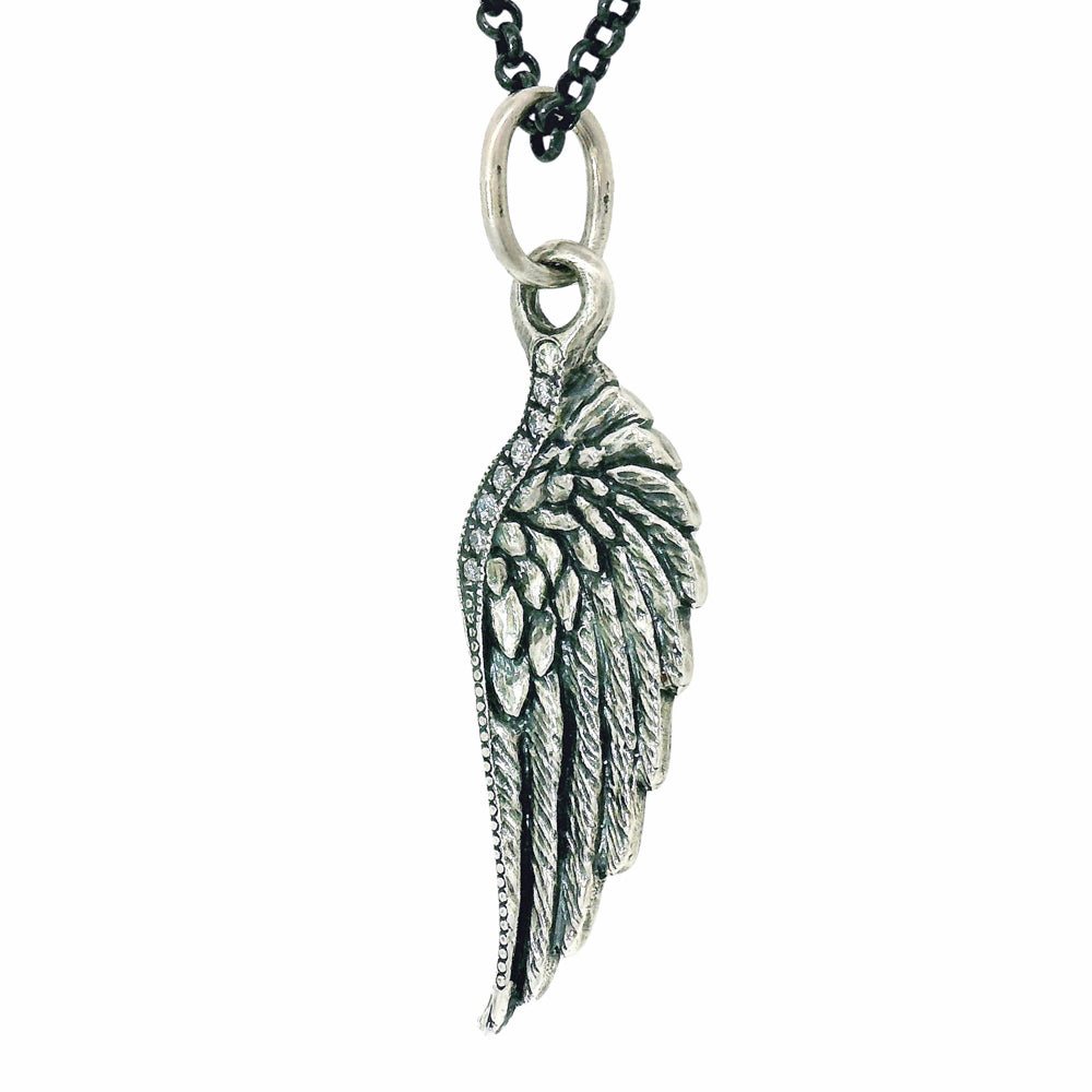 Silver angel wing pendant on a black chain against a white background