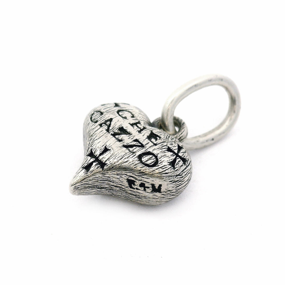 Antique-inspired heart pendant with satin finish and cross motifs