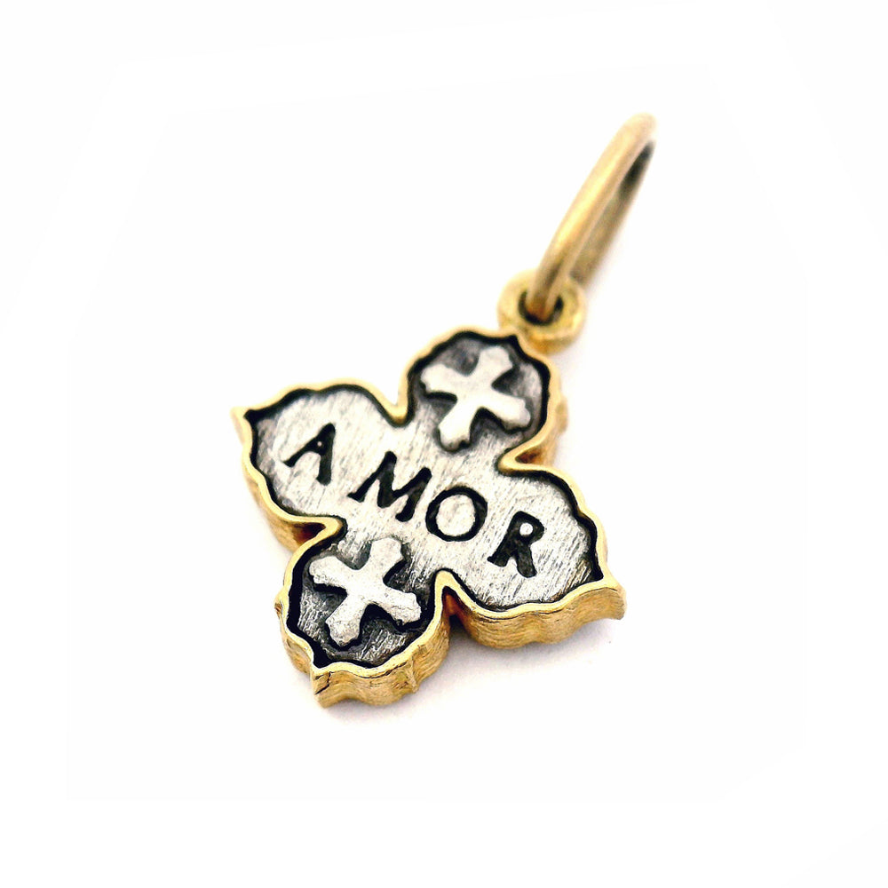 Reversible quatrefoil diamond cross charm by Erica Molinari in gold and silver