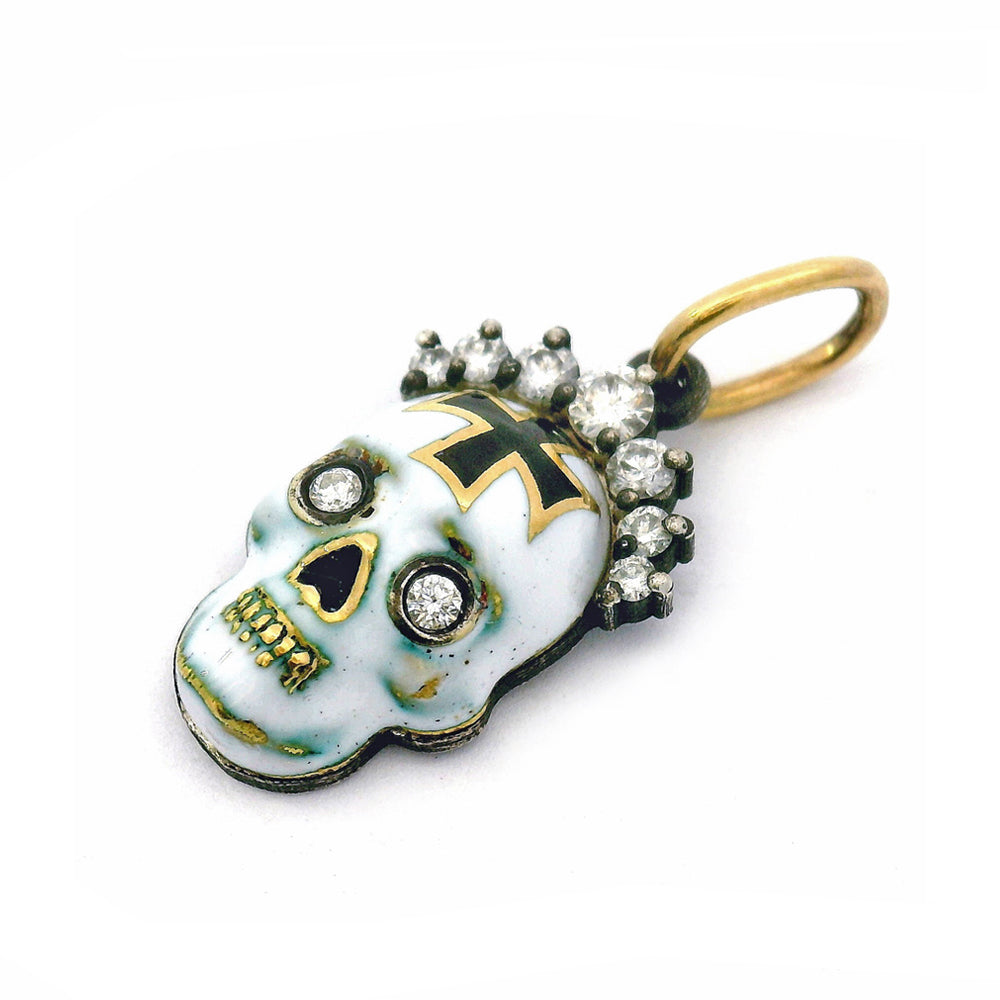 Close-up of bezel-set diamond eyes on handcrafted skull pendant