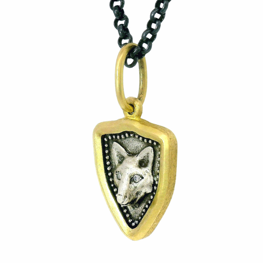 Reversible fox charm pendant by Erica Molinari in gold and oxidized silver