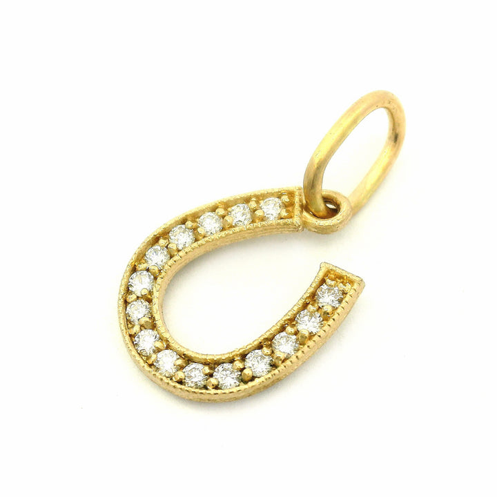 Diamond horseshoe charm by Erica Molinari in 14K yellow gold