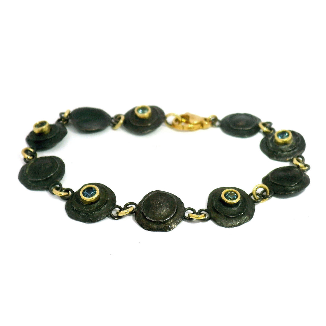 Still Standing bullet link bracelet with five blue Montana sapphires in oxidized silver