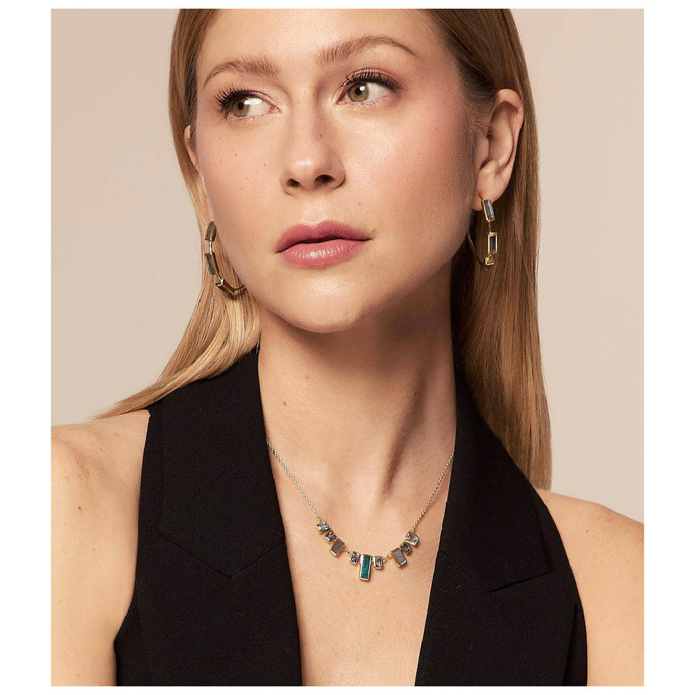 Woman wearing Empire labradorite hoop earrings from Alara Jewelry