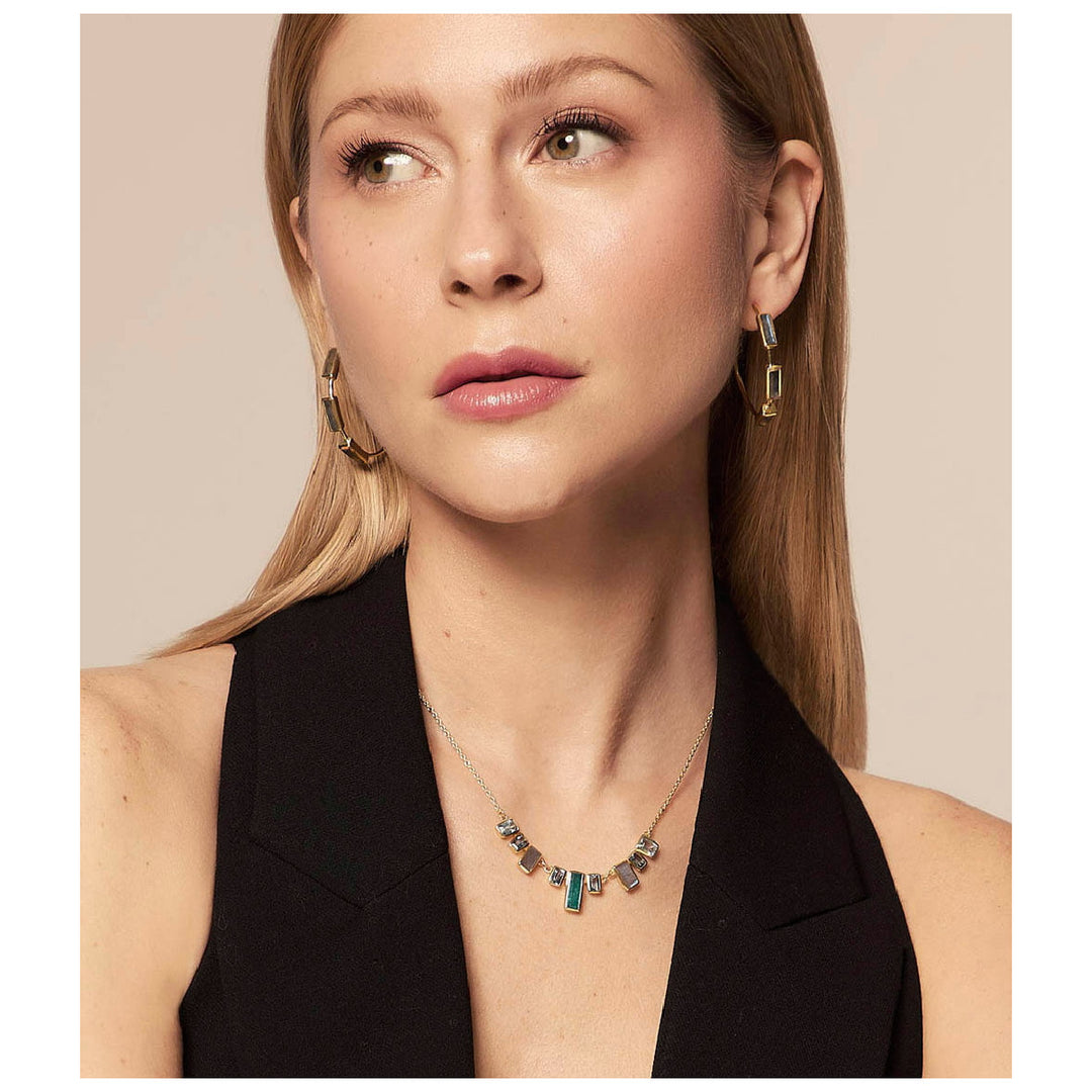 Woman wearing Empire labradorite hoop earrings from Alara Jewelry