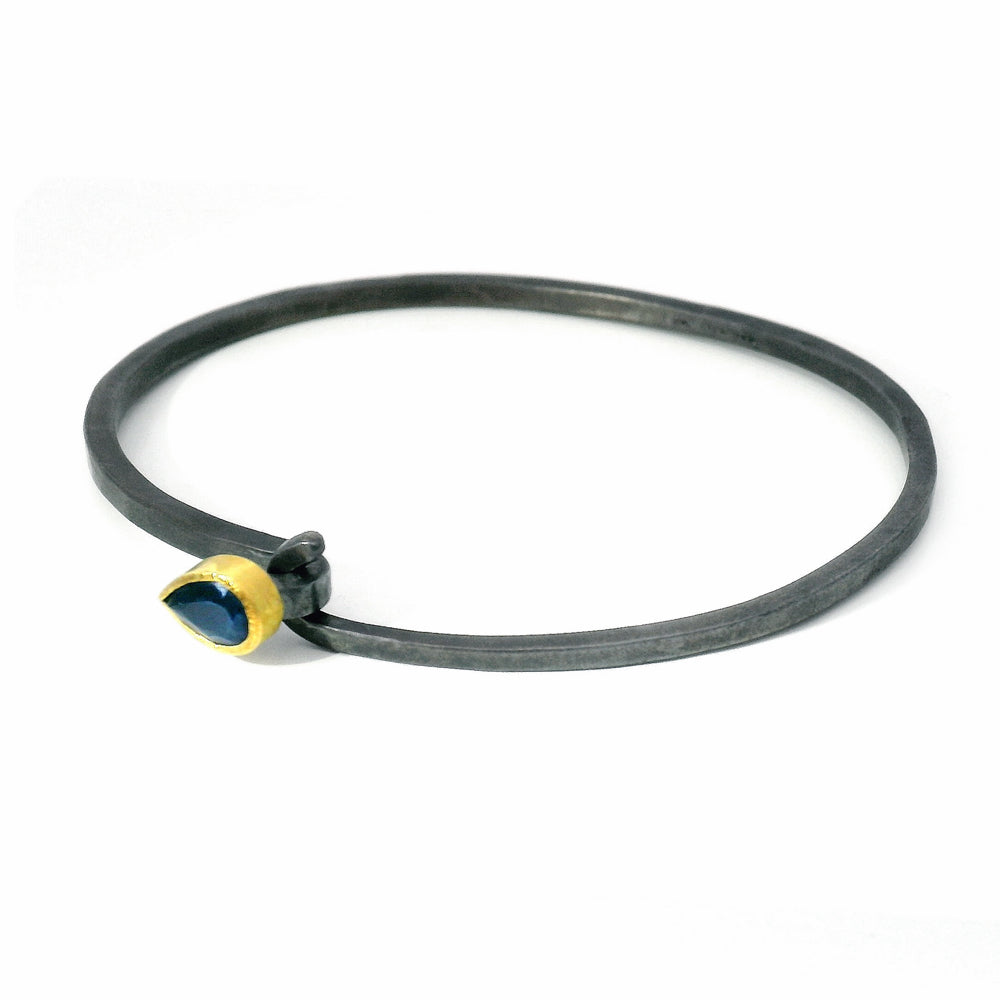Blue Montana sapphire hook bracelet by Karin Jacobson in gold and oxidized silver