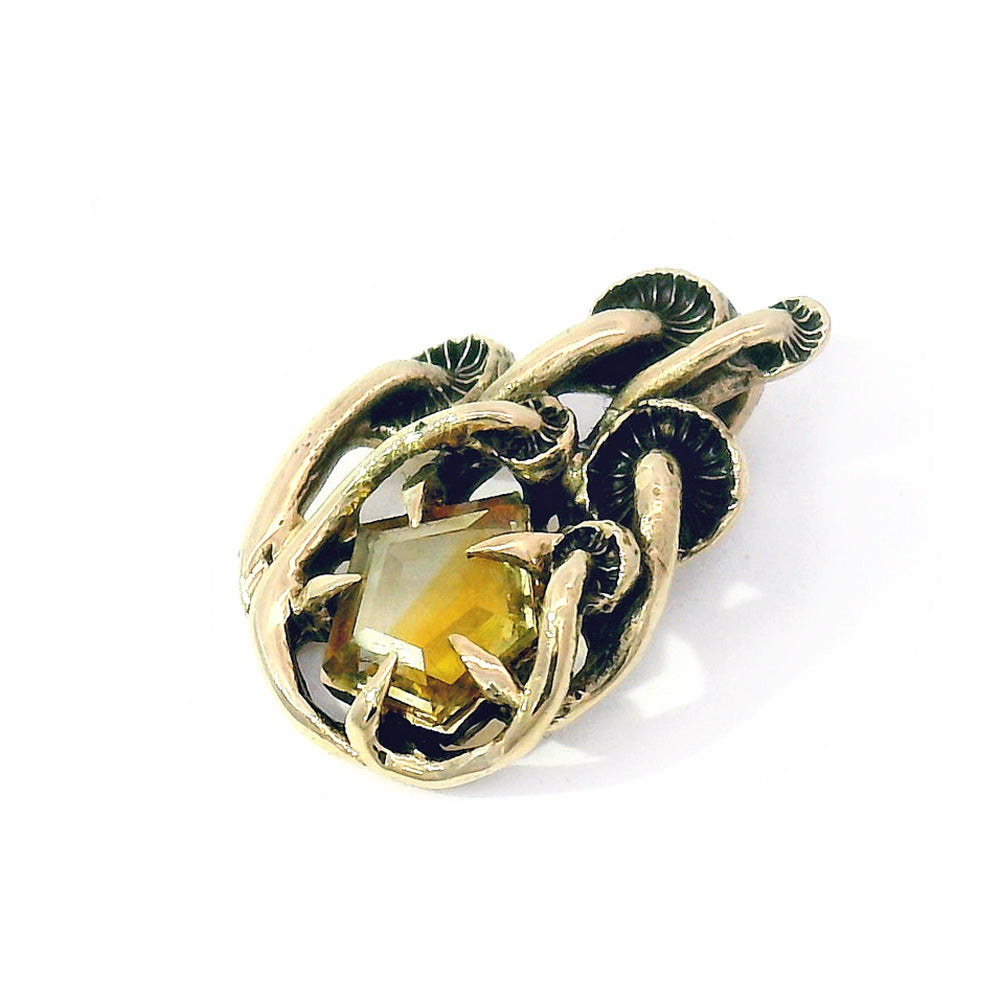 Geo-cut sapphire pendant with sculptural mushroom detail
