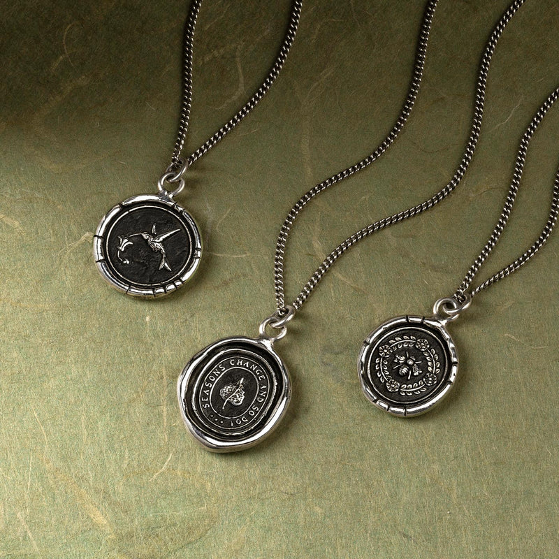 Antiqued silver pendant with hummingbird detail on curb link chain