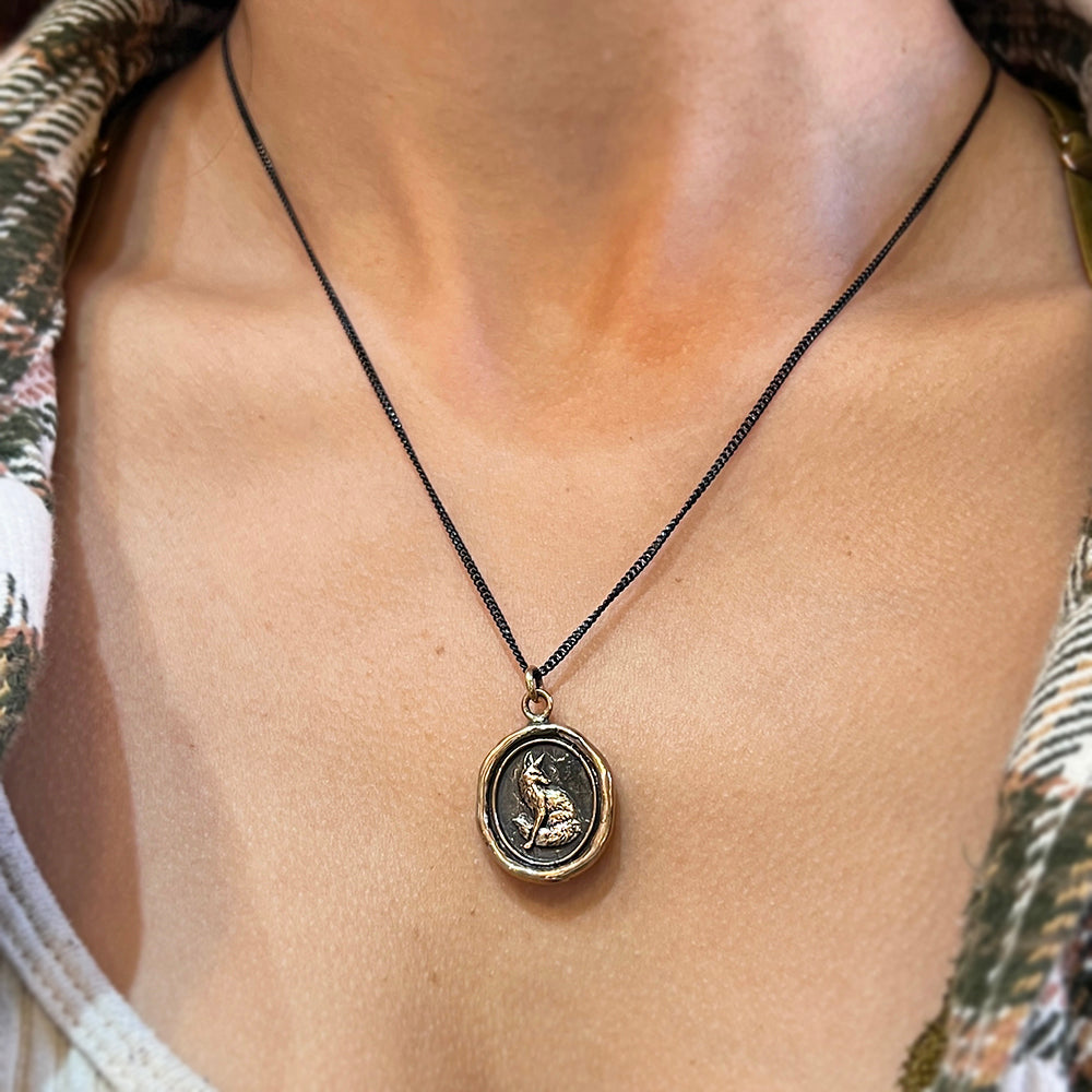 Woman wearing Trust in Yourself fox talisman necklace by Pyrrha from Alara Jewelry
