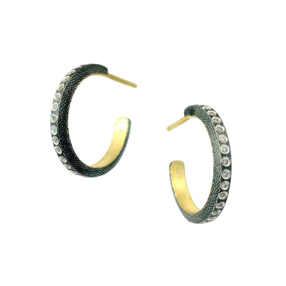 Mixed-metal diamond hoops with white diamond accents along front edge