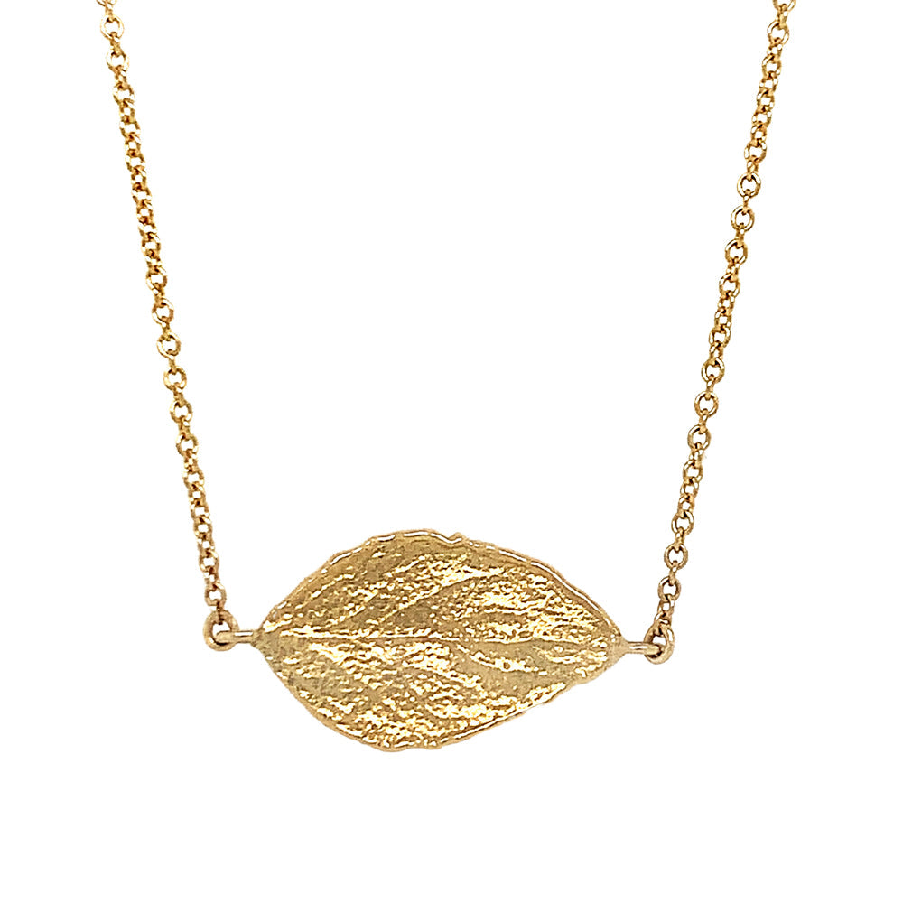 Textured gold leaf pendant on fine cable chain