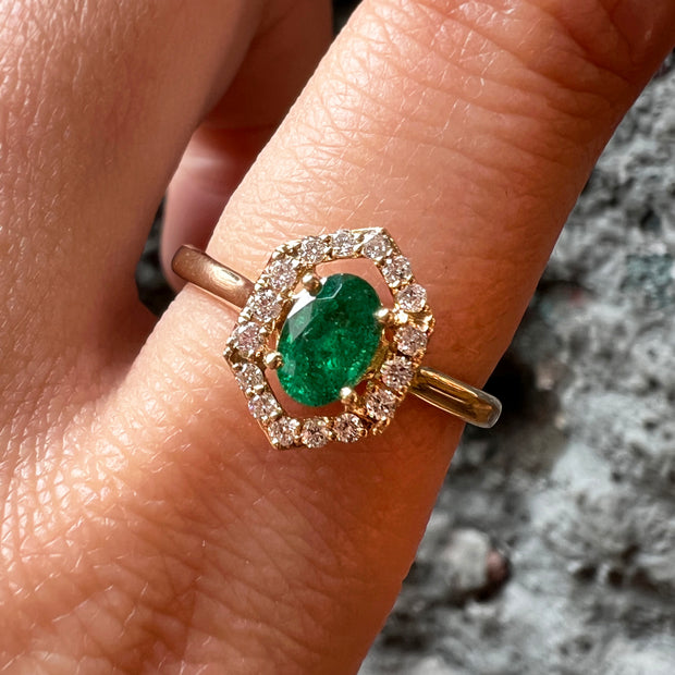 Oval Emerald, Diamond Halo, and 14K Yellow Gold Ring Model Close Up