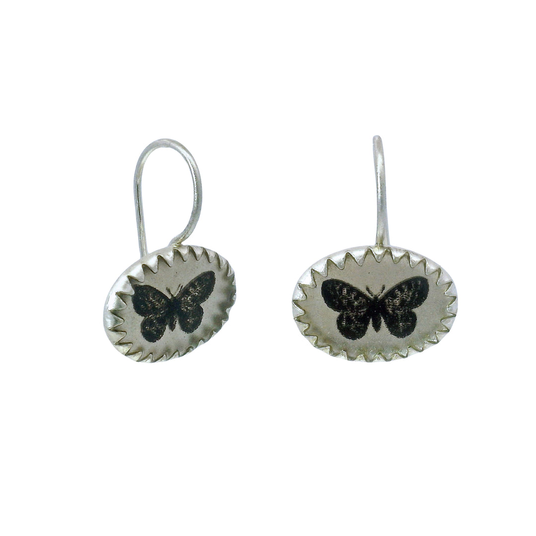Etched butterfly drop earrings with darkened detail and kidney wires