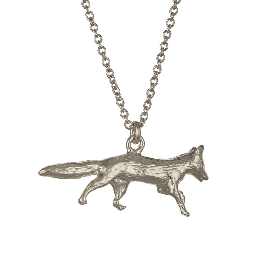 Close-up of hand-detailed fox pendant showing alert posture and tail.