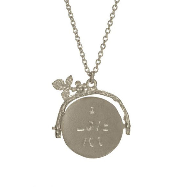 Spinning "I love you" necklace. Crafted from sterling silver this adorable little pendant reveals its caring message only when being spun.