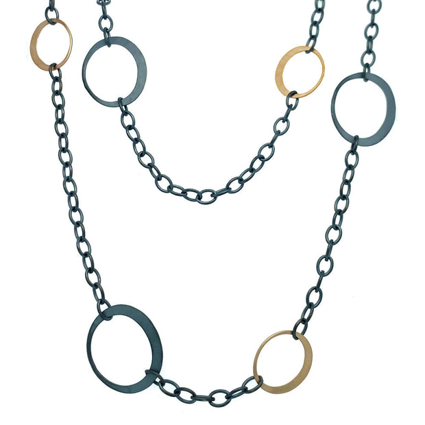 •	Toby Pombroy, blackened Sterling silver (.925 EcoSilver ) and  matte 14 karat yellow (EcoGold). Length: 35" cable chain (adjustable), eclipse dimensions: EcoGold 1/2" x 5/8"", EcoSilver 5/8" x 3/4".